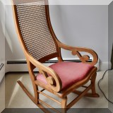 F46. Antique caned rocker. 